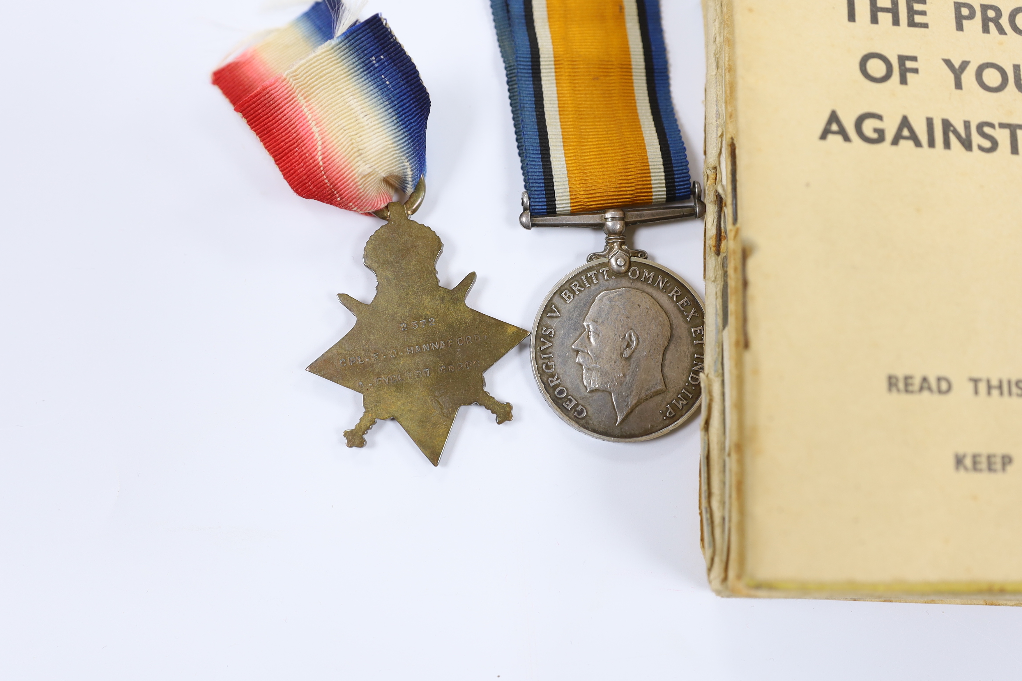 A First World War medal trio to Cpl. E.J. Hannaford, and a small collection of WWII publications including Home Guard instruction booklets, Civil Defence booklets, plus an R.L.S.S. ribbon and a WV badge, etc.